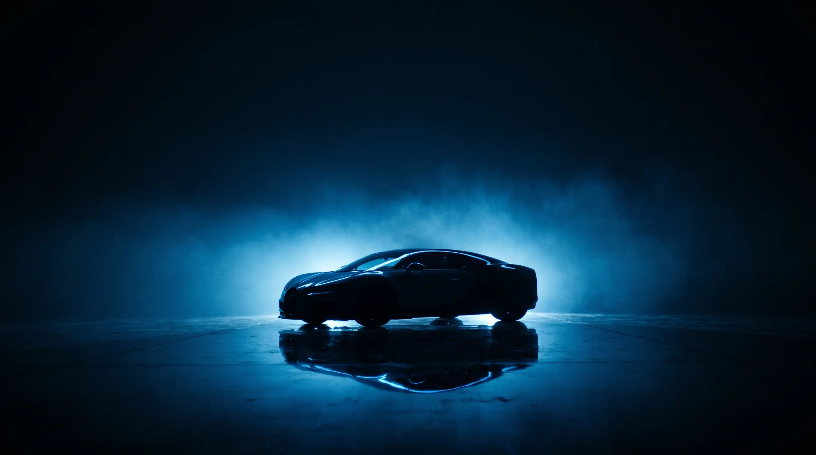 Dark supercar under an electric blue halo in a studio
